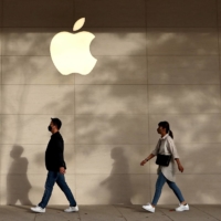 The Apple store in Taipei, Taiwan on Tuesday. Although Apple stocks are down 24% in 2022, it is performing better than many of its tech peers who have been laying off thousands of workers in the face of a sales slowdown. | REUTERS