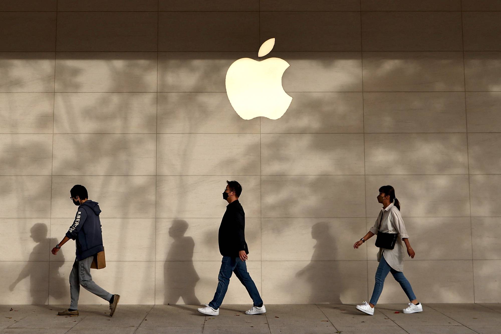 The Apple store in Taipei, Taiwan on Tuesday. Although Apple stocks are down 24% in 2022, it is performing better than many of its tech peers who have been laying off thousands of workers in the face of a sales slowdown. | REUTERS
