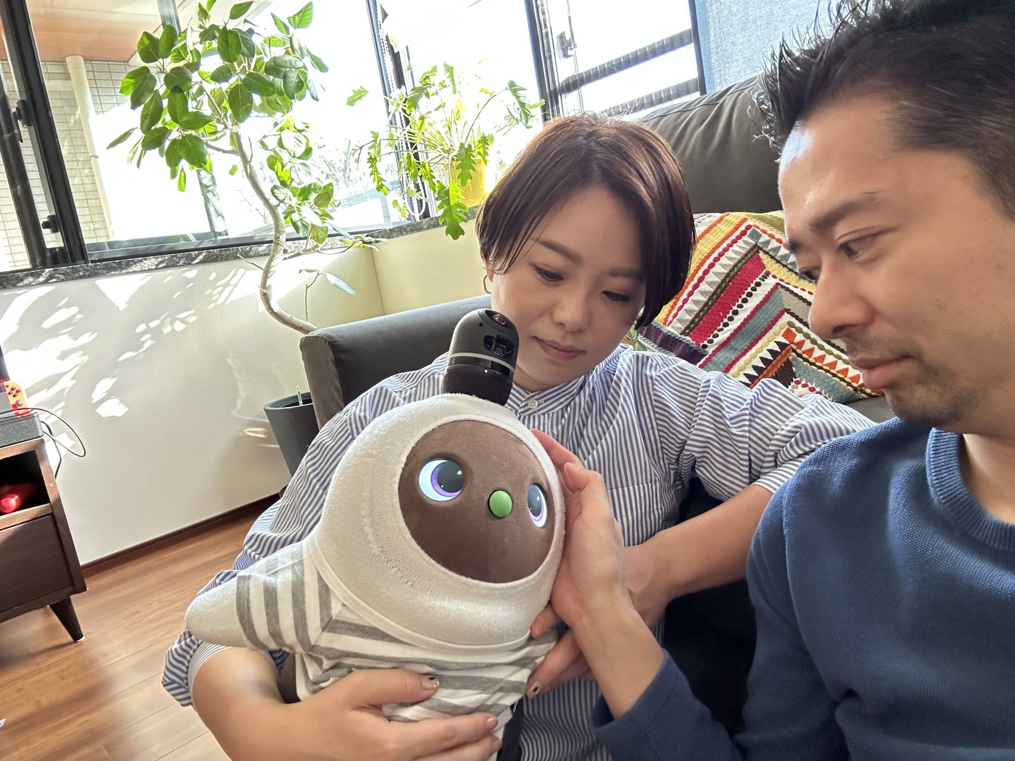 Ai and Hideyuki Shimizu say that their Lovot fills the same role in their lives that owning a pet otherwise would. | COURTESY OF LOVOT