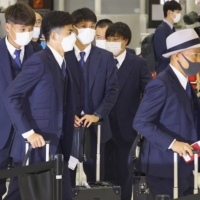 Members of the Japan team arrived in Doha on Thursday. | KYODO