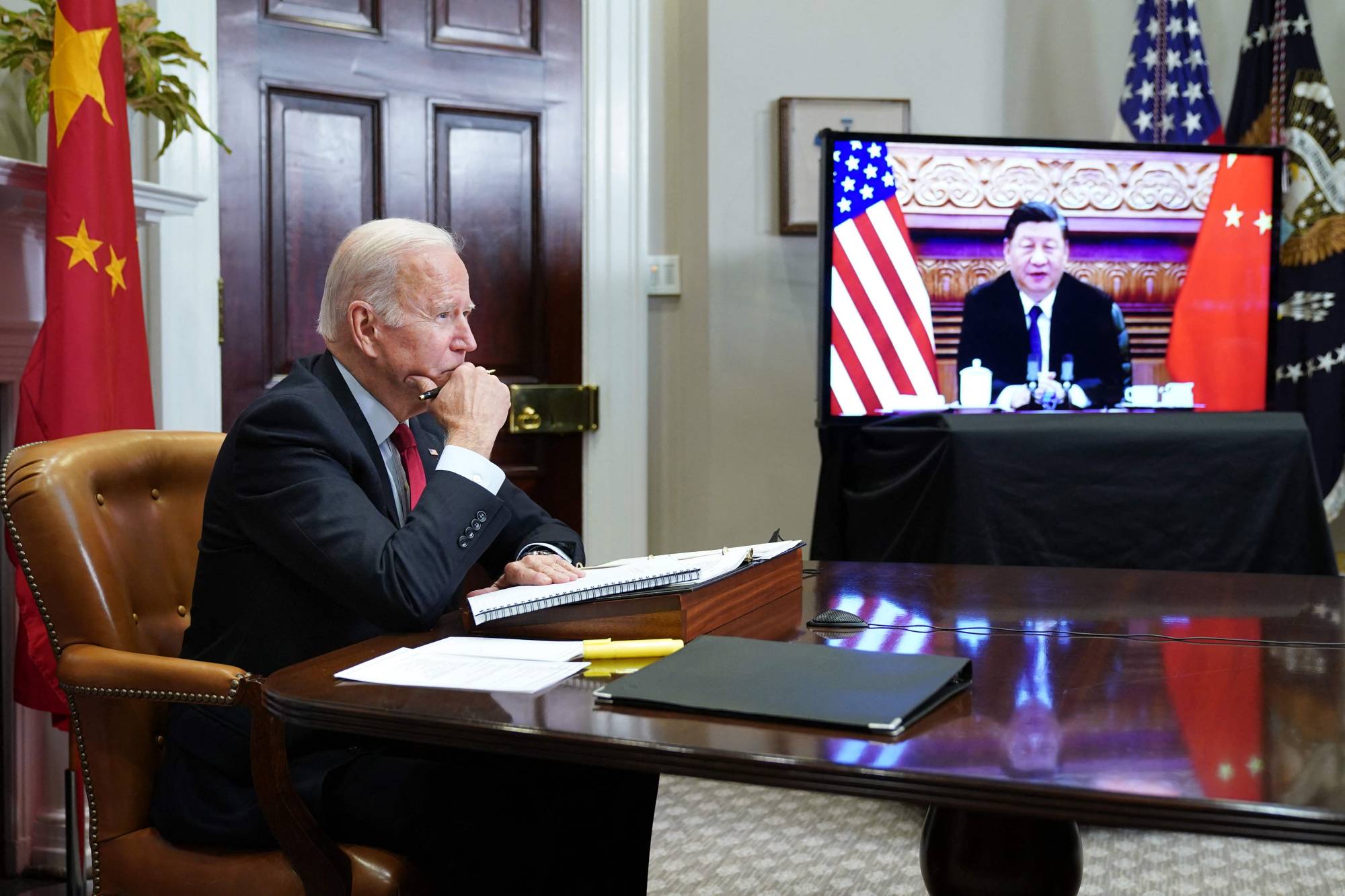 U.S. President Joe Biden speaks with Chinese leader Xi Jinping during a virtual summit from the Roosevelt Room of the White House in Washington in November last year. | AFP-JIJI