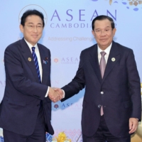 Prime Minister Fumio Kishida and Cambodian Prime Minister Hun Sen meet in Phnom Penh on Saturday. | POOL / VIA KYODO
