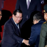 Cambodian Prime Minister Hun Sen arrives at Ngurah Rai International Airport ahead of the Group of 20 Summit in Bali, Indonesia, on Monday.  | POOL / VIA AFP-JIJI