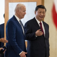U.S. President Joe Biden speaks with Chinese leader Xi Jinping during their first in-person meeting since Biden took office, in Bali, Indonesia, on Monday. | DOUG MILLS / THE NEW YORK TIMES