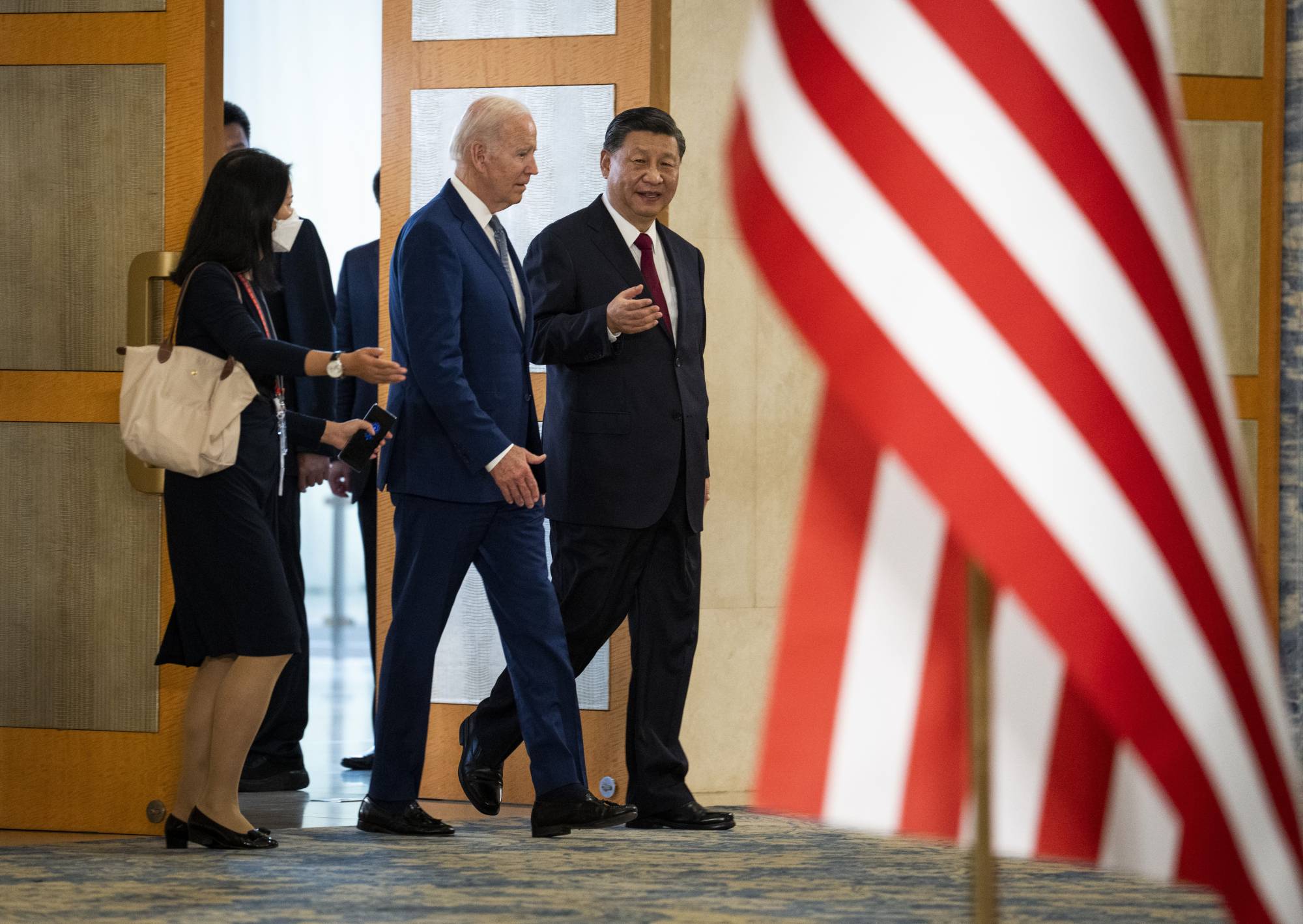 U.S. President Joe Biden speaks with Chinese leader Xi Jinping during their first in-person meeting since Biden took office, in Bali, Indonesia, on Monday. | DOUG MILLS / THE NEW YORK TIMES