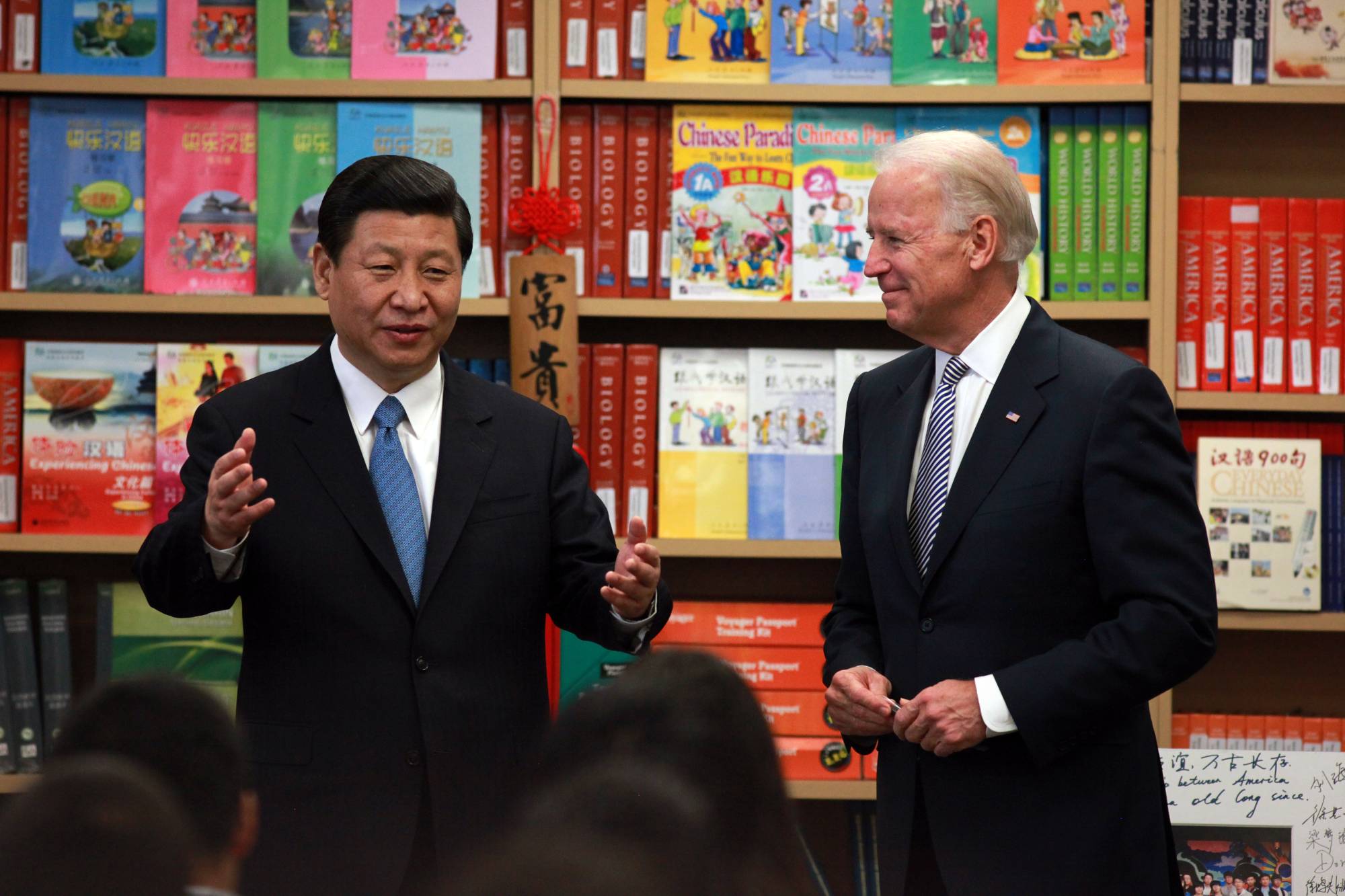 Xi and Biden, then both vice presidents of their respective countries, speak with students at the International Studies Learning Center, a high school in South Gate, California, in February 2012. | Monica Almeida / The New York Times