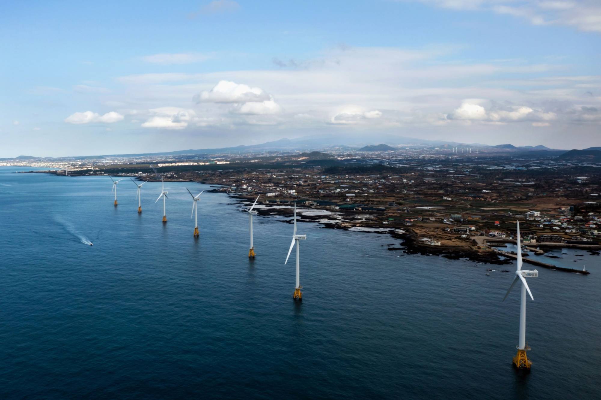 Offshore wind turbines at the Tamra Offshore Wind Power in Jeju, South Korea, in January | BLOOMBERG