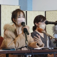 Doan Thi Thu Nga (left) speaks at a news conference along with other Vietnamese trainees in Matsuyama, Ehime Prefecture, on Wednesday. | KYODO