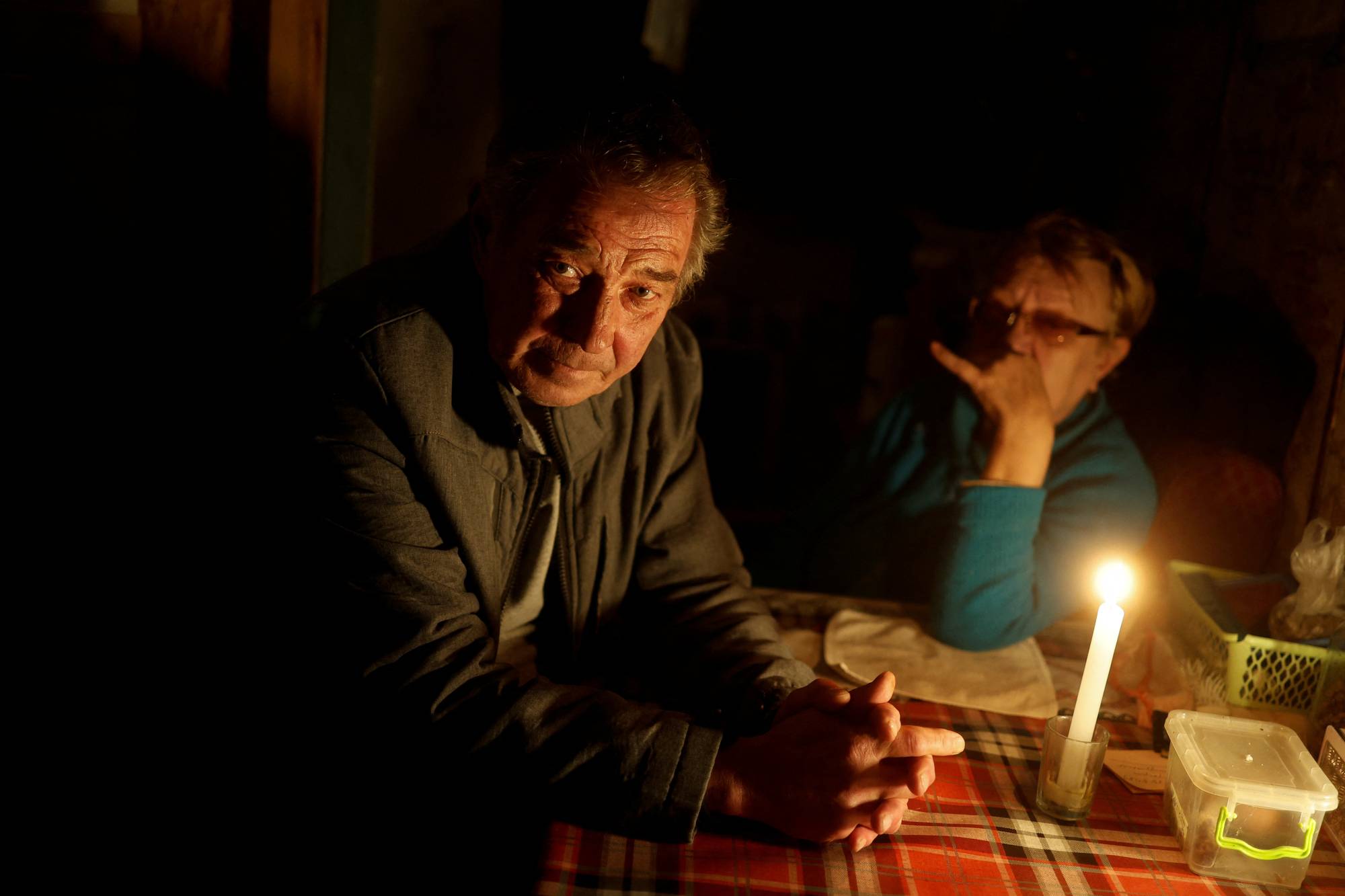 Vitalii Serdiuk, who says he was tortured by Russian service members, and his wife, Olena. | Reuters 