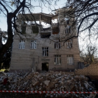 A building used by Russians as a military commandant\'s office — which was also hit by a military strike — in Kherson. | REUTERS 