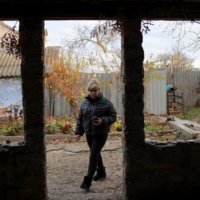 Aliona Lapchuk, a Ukrainian woman who said her husband was tortured and left to die by Russian forces in Kherson at the beginning of the war, at her home in Ukraine\'s Mykolaiv region. | REUTERS