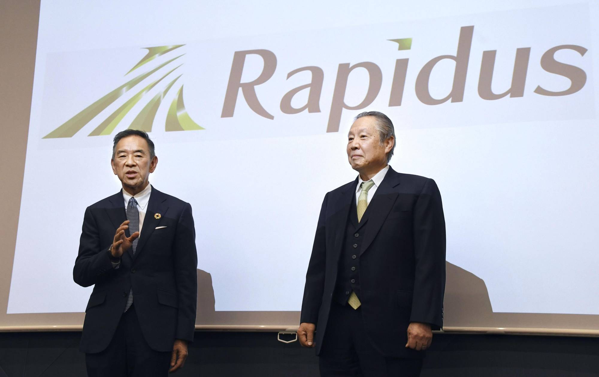 Rapidus President Atsuyoshi Koike (left) and Chairman Tetsuro Higashi hold a news conference in Tokyo on Friday. | KYODO