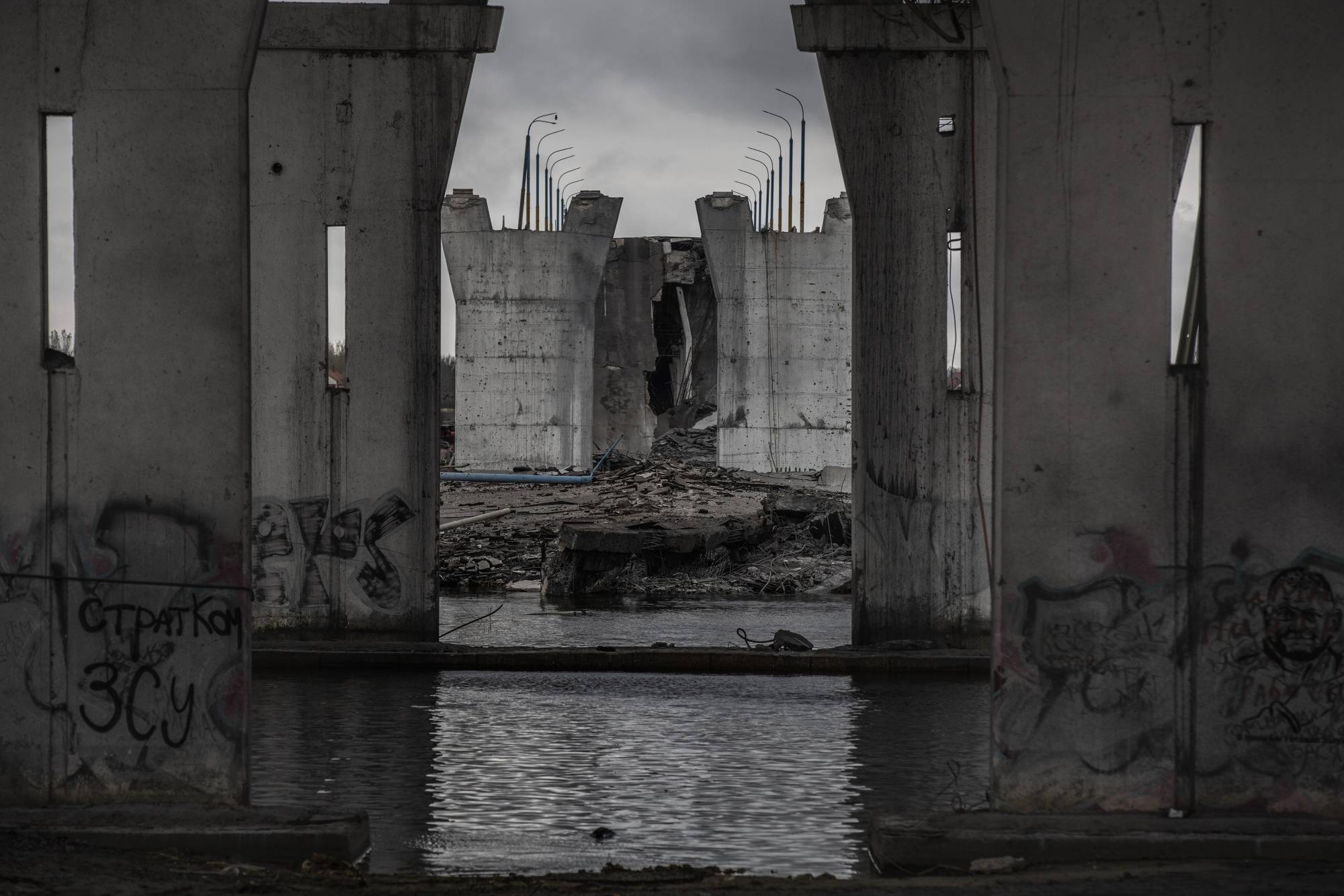 The Antonovskiy bridge, destroyed by retreating Russian forces, in Kherson on Wednesday | Finbarr O'Reilly / The New York Times