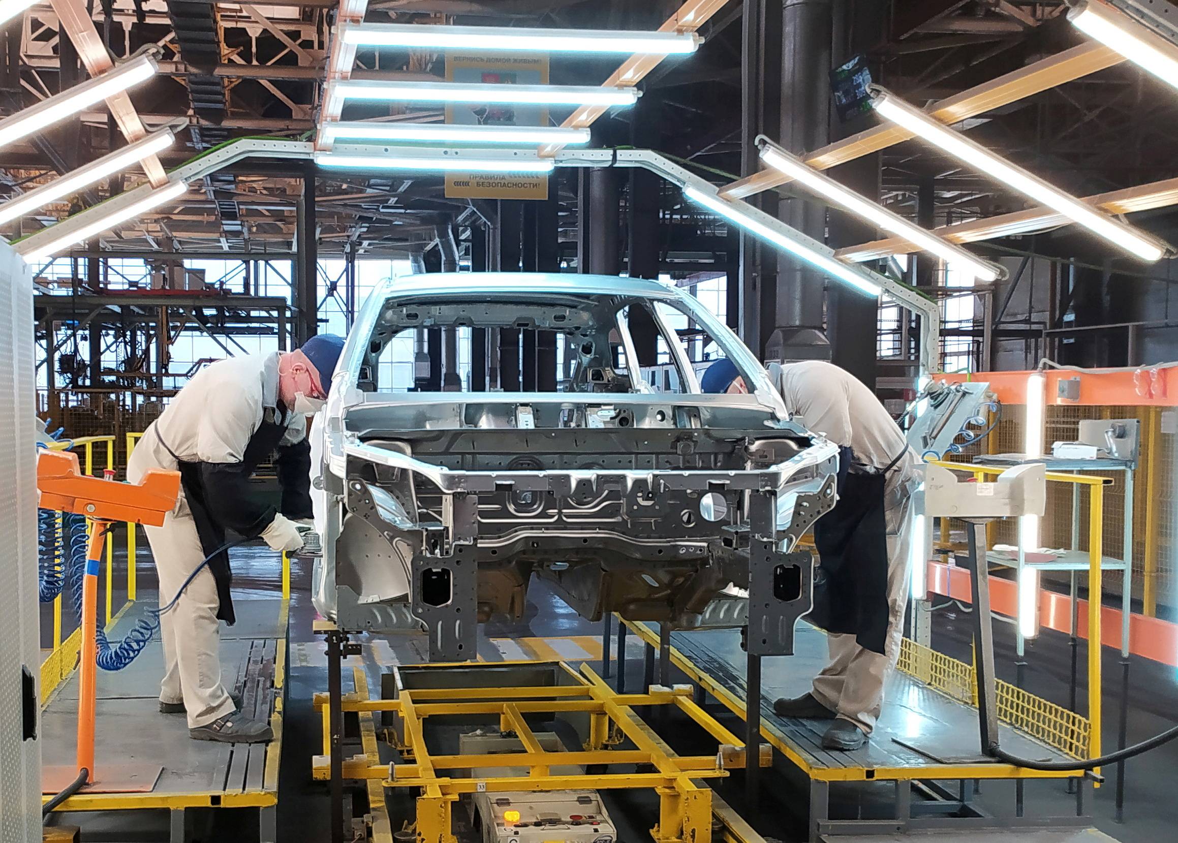 Employees work on the assembly line of the Lada Izhevsk automobile plant, part of the Avtovaz Group, in Izhevsk, Russia, on Feb. 22. Lada was Russia's bestselling car marque in 2021. | Reuters