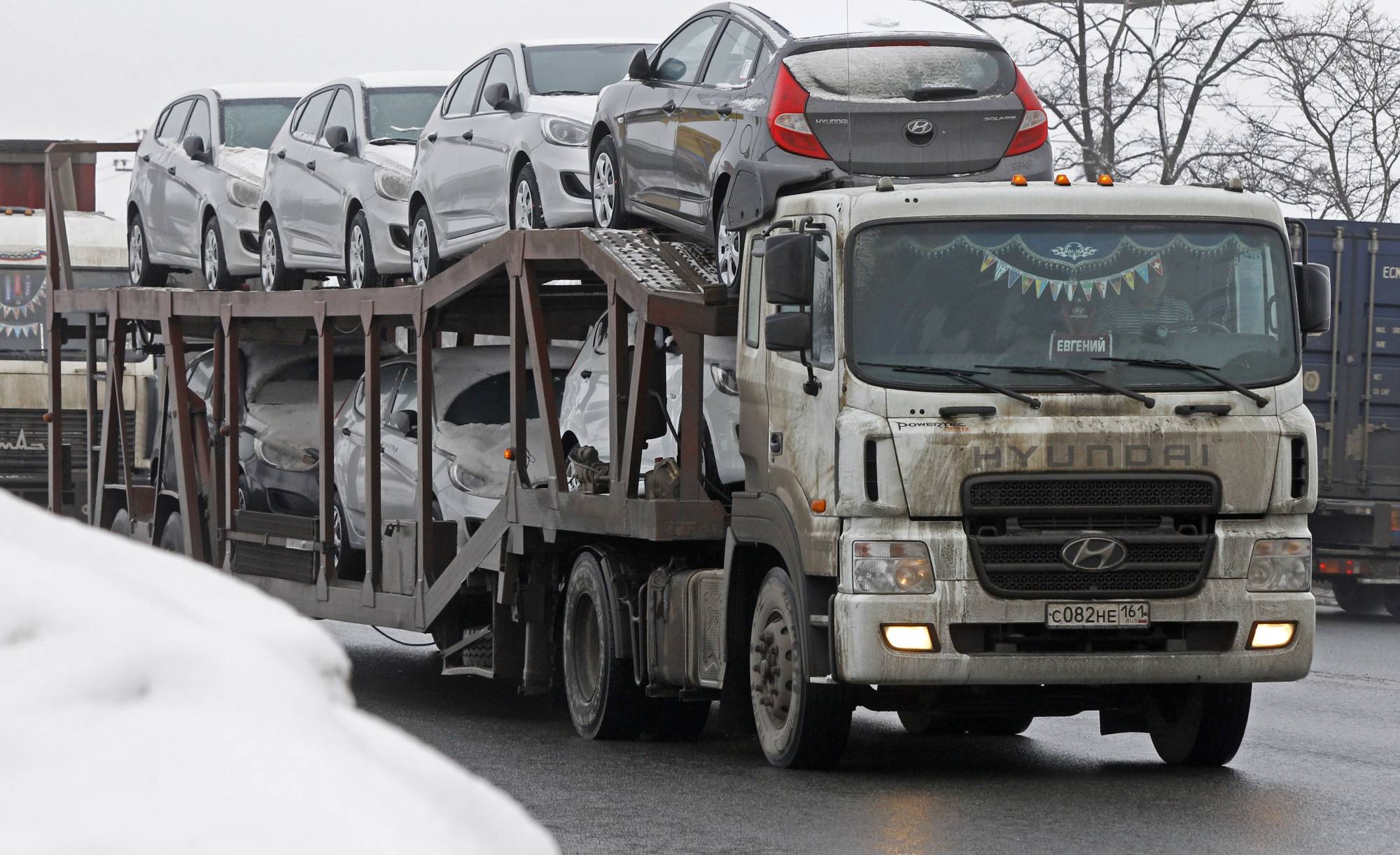 New Hyundai vehicles are transported on a highway leading from Moscow in February 2013. The firm boasted a 10% share of car sales in Russia in 2021. | Reuters