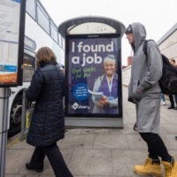 Commuters board a bus in Folkestone, U.K., on Monday. A new study says that while fears of a recession may temporarily put a freeze on hiring, over the long-term, the market is likely to skew toward job-seekers. | BLOOMBERG.