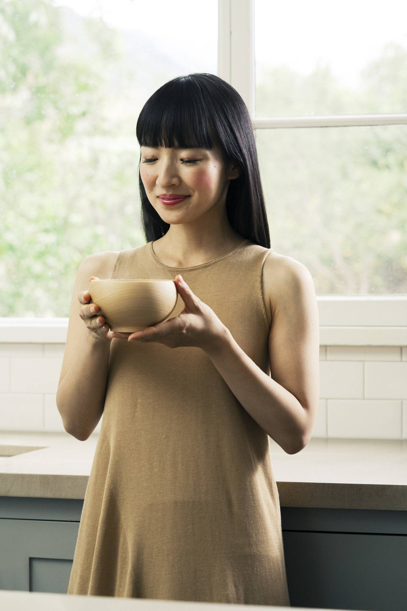 'Through the process of selecting what brings you joy and letting go of what doesn’t, you develop your capacity to choose, to make decisions, and to take action,' Marie Kondo writes, sounding more than ever like a life coach. | NASTASSIA BRUCKIN / VIA THE NEW YORK TIMES