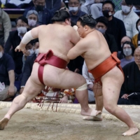 Hoshoryu pushes Daieisho during their bout on Day 6 of the Kyushu Grand Sumo Tournament in Fukuoka on Friday. | KYODO