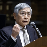 Bank of Japan Gov. Haruhiko Kuroda speaks in Tokyo on Tuesday.  | BLOOMBERG