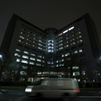 A van is seen on a road in front of Tokyo Regional Immigration Bureau, which includes the Tokyo detention center in the Japanese capital. | REUTERS
