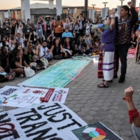 Climate activists chant slogans during the COP27 climate conference in Egypt\'s Red Sea resort city of Sharm el-Sheikh on Friday. | AFP-JIJI