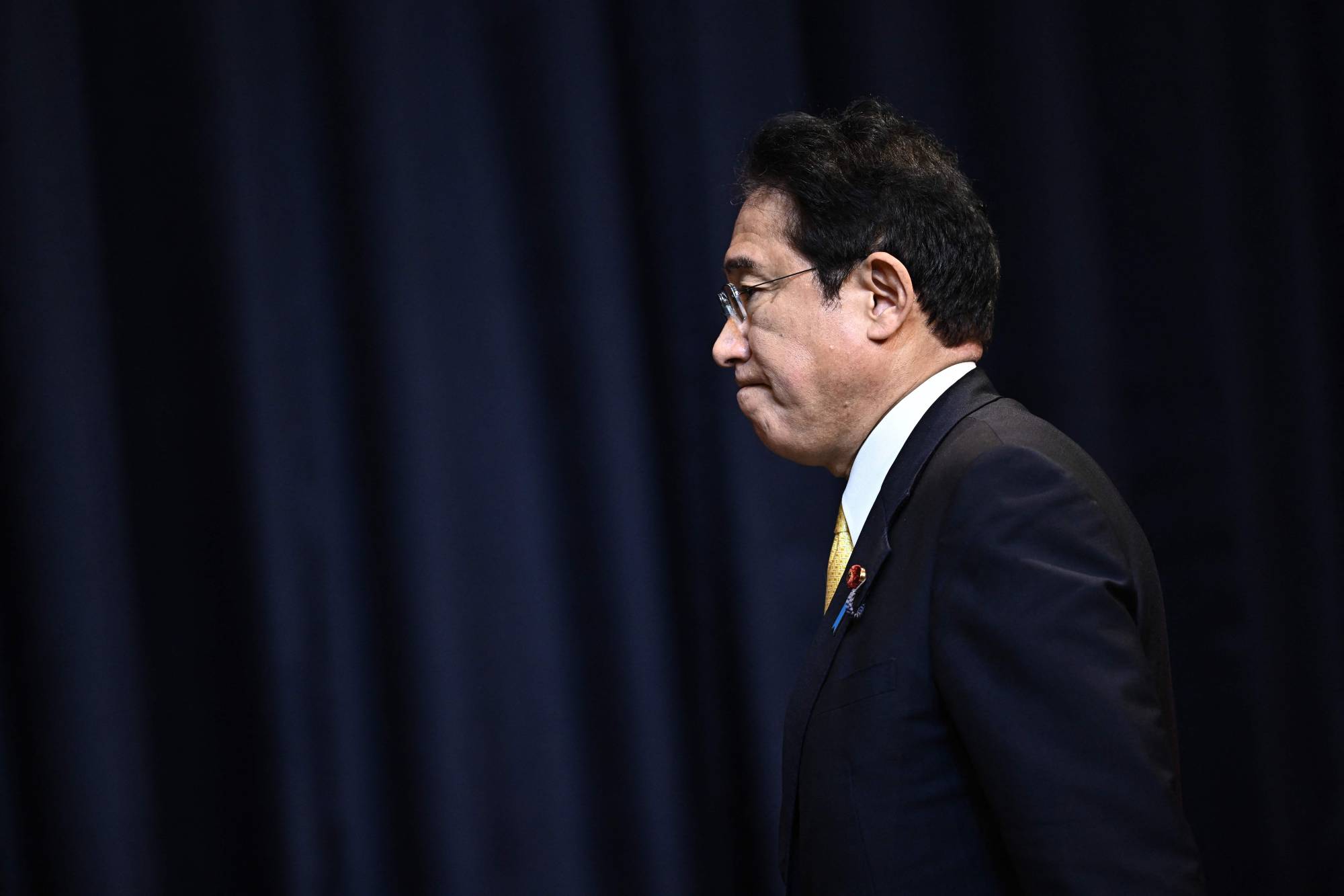 Prime Minister Fumio Kishida attends a news conference during the Asia-Pacific Economic Cooperation summit in Bangkok on Saturday. | AFP-JIJI