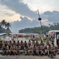 Police officers are deployed as fishermen protest near the entrance of the proposed Vizhinjam Port. | REUTERS
