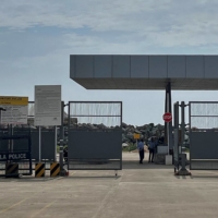 Private security guards stand near an entrance of the proposed Vizhinjam Port. | REUTERS