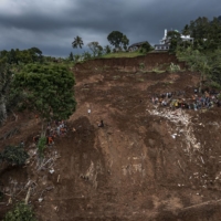 Rescue teams look for victims in Cugenang village on Wednesday. | ULET IFANSASTI / THE NEW YORK TIMES