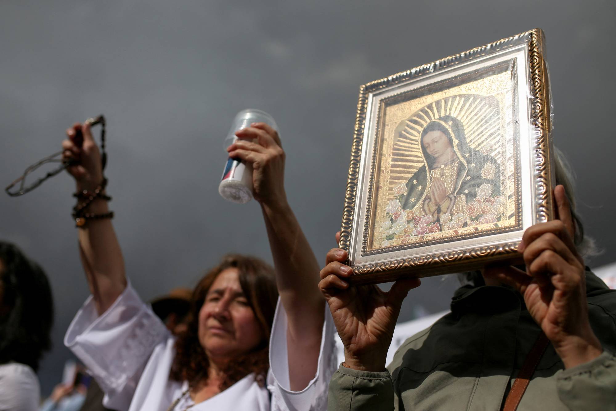 A demonstrator holds a painting with the image of the Virgin Mary during a protest against abortion in Bogota, Colombia, on Wednesday. | REUTERS 