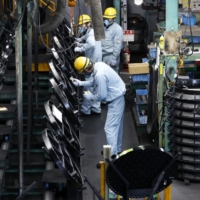 Japan\'s factory activity marked the first monthly decline in 22 months in November and raised a question mark over the country\'s economic outlook. | BLOOMBERG