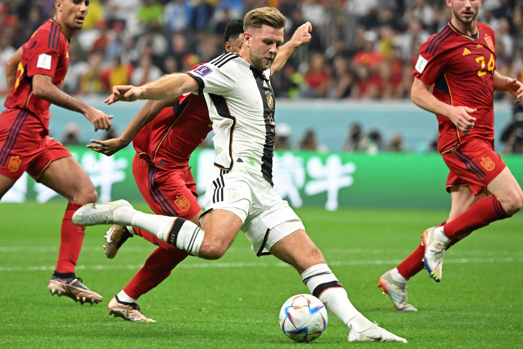 Germany rallies for draw against Spain to keep hopes alive at World Cup