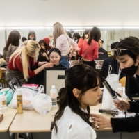 Finalists are fussed over as they prepare for the Miss Mister Aoyama pageants at Aoyama Gakuin University in Tokyo, on Oct. 30. | SHIHO FUKADA / THE NEW YORK TIMES