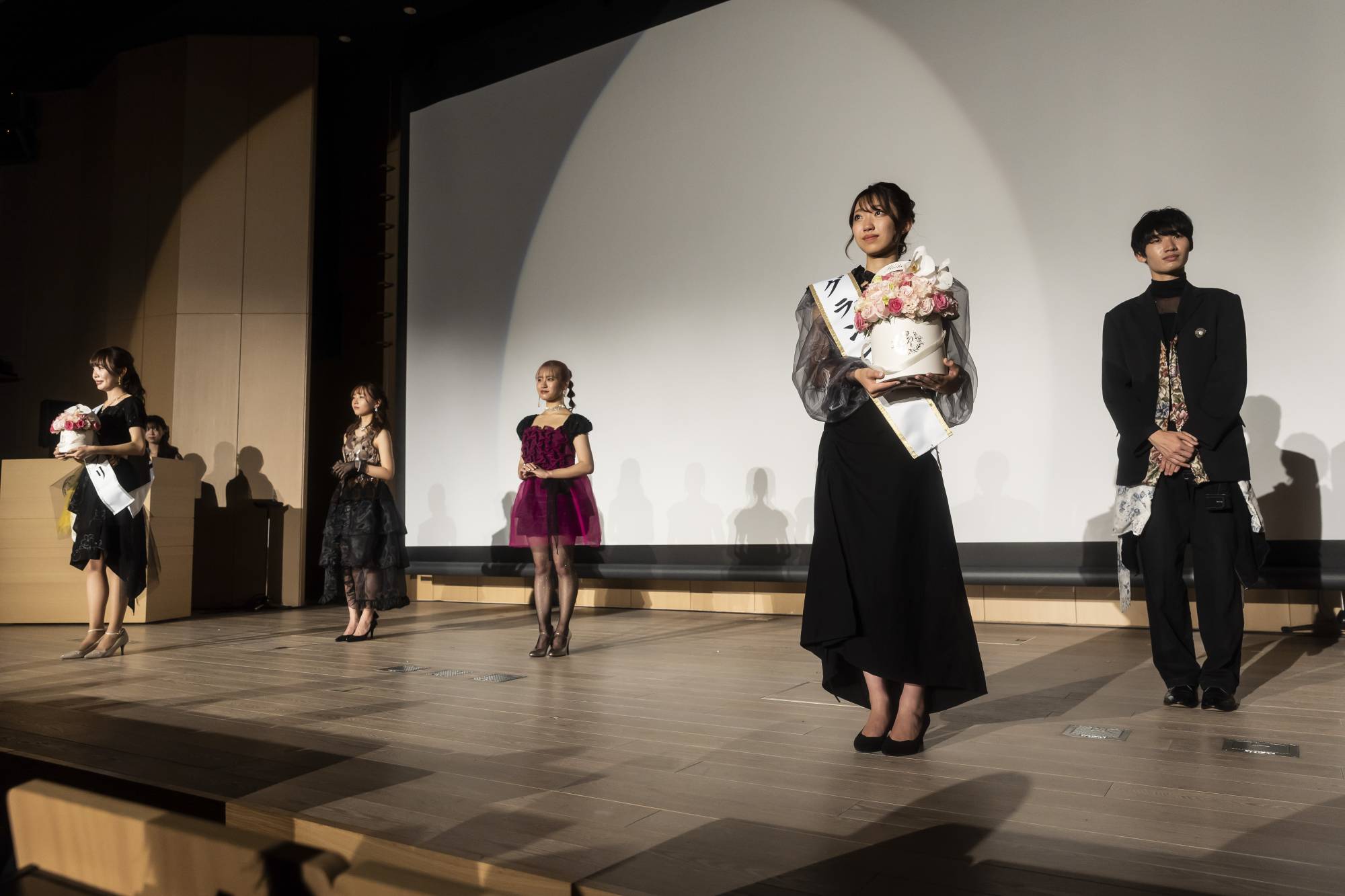 Finalists on stage for the announcement of a winner in Sophia University’s pageant, where organizers unified the male and female contests and invited entrants who identified anywhere along the gender spectrum, in Tokyo, on Nov. 3. | Shiho Fukada / The New York Times