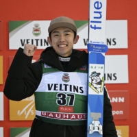 Naoki Nakamura on the podium after a third-place finish in a World Cup event n Ruka, Finland, on Sunday. | REUTERS