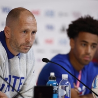U.S. head coach Gregg Berhalter (left) and captain Tyler Adams answer questions during a news conference in Doha on Monday. | REUTERS