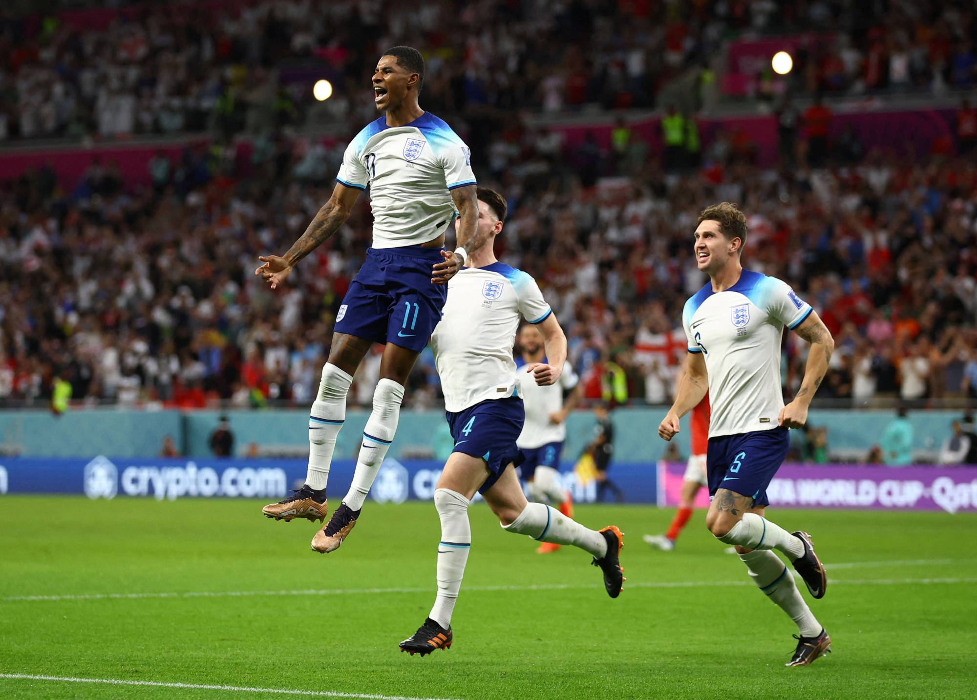England's Marcus Rashford celebrates after scoring his first of two goals against Wales in the 2022 FIFA World Cup Group B match in Al Rayyan, Qatar, on Tuesday. | REUTERS