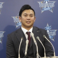 BayStars closer Yasuaki Yamasaki discusses his new contract at a news conference in Yokohama on Tuesday. | KYODO