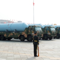 Chinese military vehicles carrying JL-2 submarine-launched ballistic missiles drive past Beijing\'s Tiananmen Square during a the 70th anniversary parade on Oct. 1. China is believed to have replaced at least some of the JL-2s on its Jin-class submarines with its more advanced JL-3 SLBMs, according to the Pentagon. | REUTERS