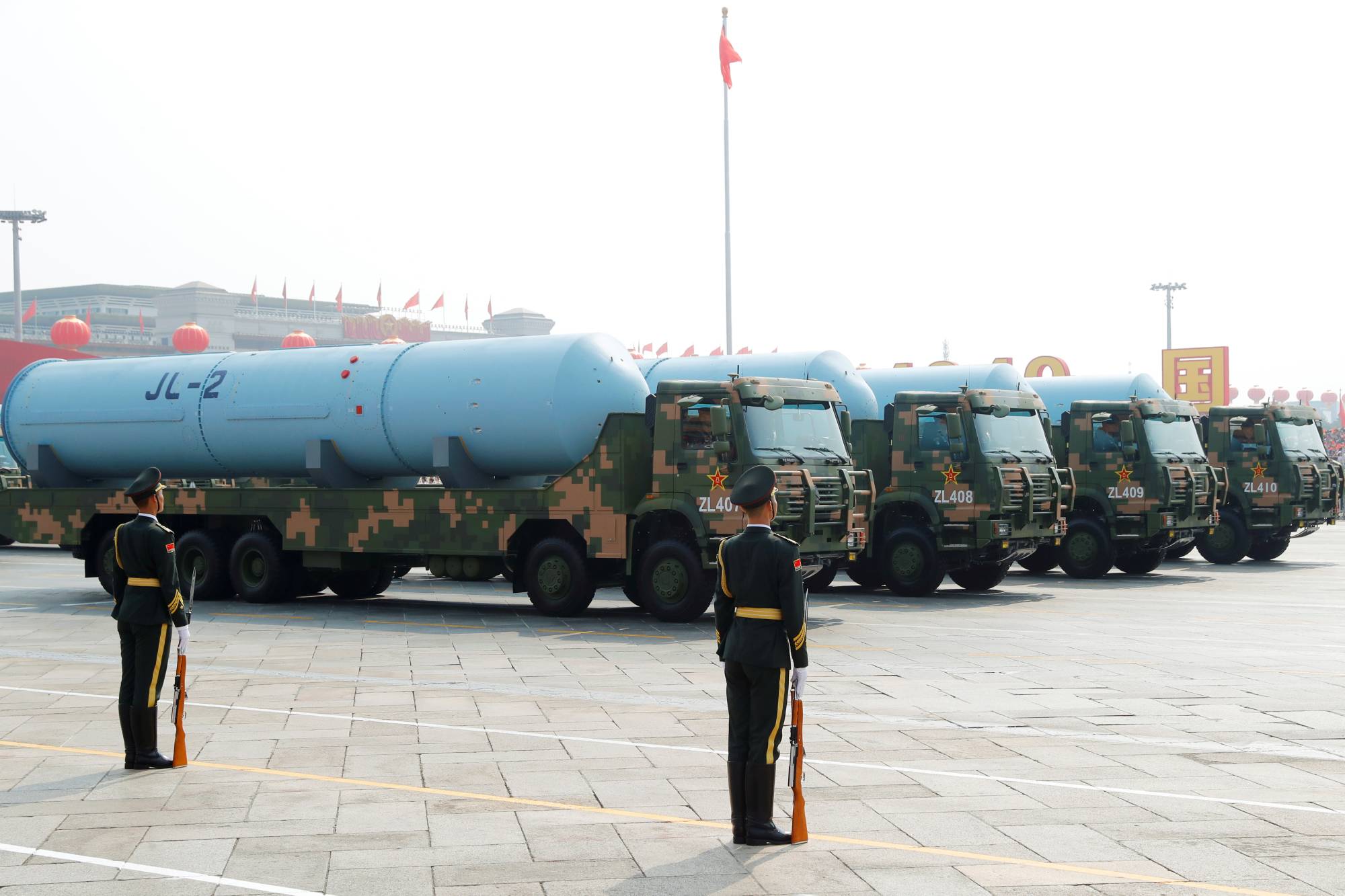 Chinese military vehicles carrying JL-2 submarine-launched ballistic missiles drive past Beijing's Tiananmen Square during a the 70th anniversary parade on Oct. 1. China is believed to have replaced at least some of the JL-2s on its Jin-class submarines with its more advanced JL-3 SLBMs, according to the Pentagon. | REUTERS