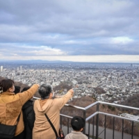People visit the observation deck at the Okurayama Ski Jump Stadium in Sapporo on Nov. 20. | AFP-JIJI