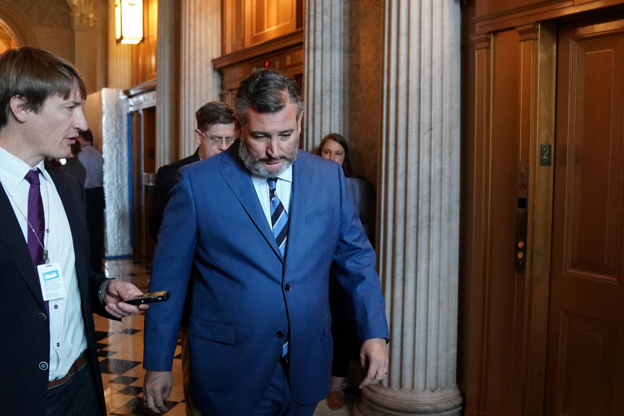 U.S. Senator Ted Cruz walks through the U.S. Capitol before the weekly Republican caucus luncheon in Washington on Tuesday. | REUTERS
