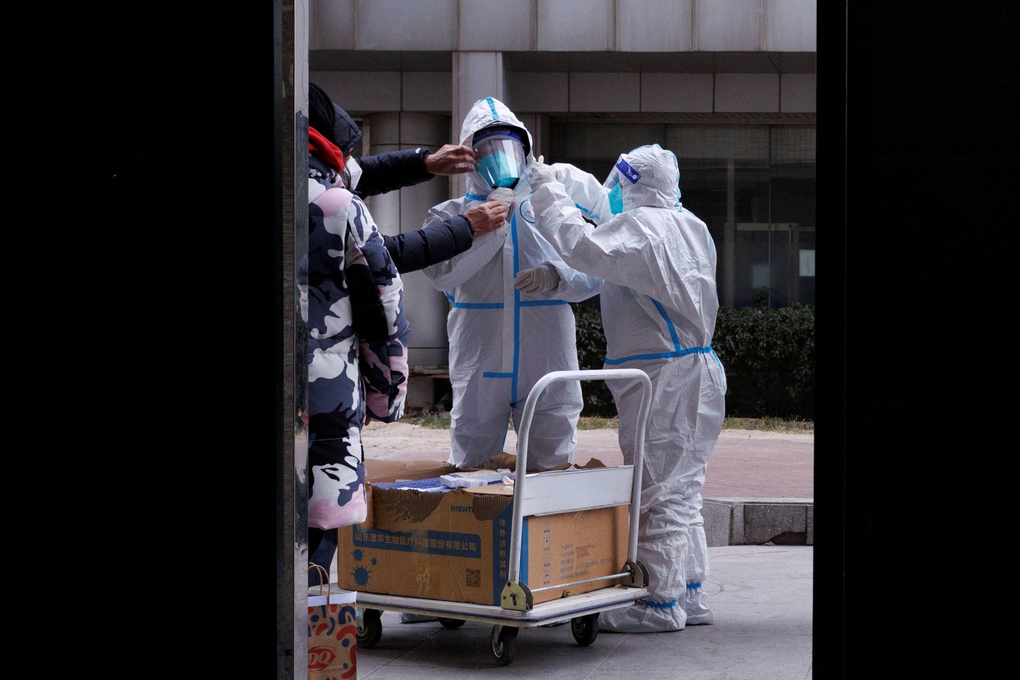 Pandemic prevention workers in Beijing on Friday | REUTERS