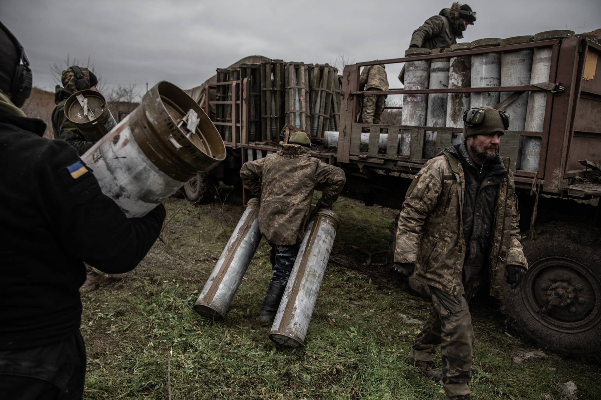 Members of a Ukrainian artillery team work during an operation to fire upon a Russian ammunition depot across the Dnieper River, in Ukraine’s southern Kherson region on Thursday. | Finbarr O’Reilly / The New York Times