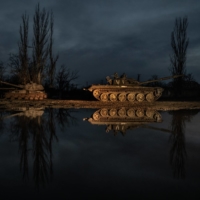 Abandoned Russian military vehicles sit by the roadside in Ukraine’s southern Kherson region on Thursday. | FINBARR O’REILLY / THE NEW YORK TIMES