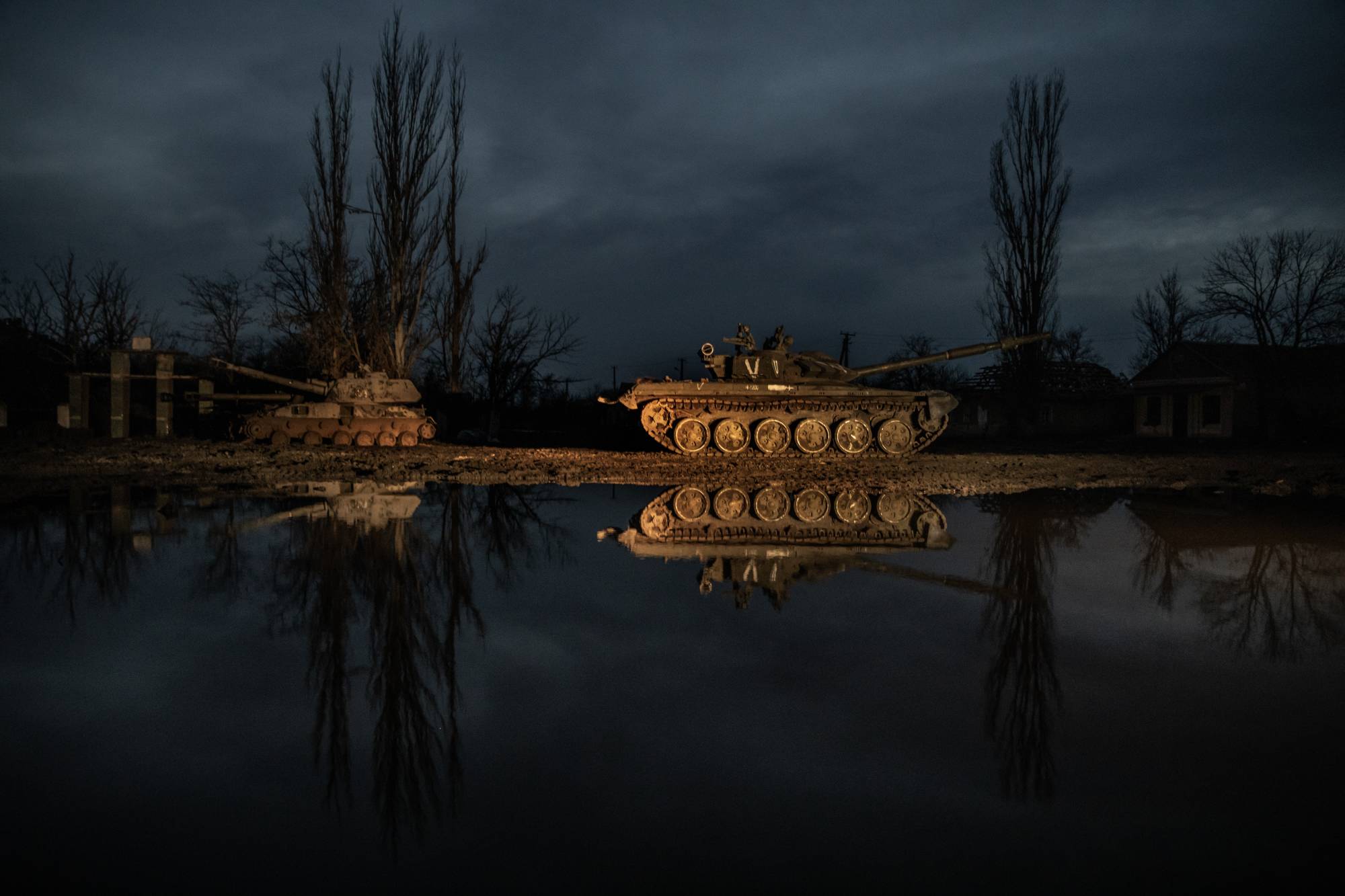 Abandoned Russian military vehicles sit by the roadside in Ukraine’s southern Kherson region on Thursday. | Finbarr O’Reilly / The New York Times