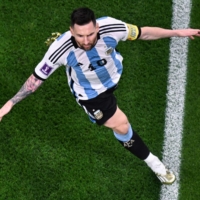 Argentina forward Lionel Messi celebrates after scoring his team\'s first goal during the Round of 16 2022 FIFA World Cup match against Australia in Al-Rayyan, Qatar, on Saturday. | AFP-JIJI