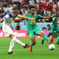 Harry Kane scores against Senegal during their match in Al Khor, Qatar, on Sunday. | REUTERS