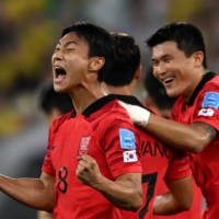South Korea\'s Paik Seung-ho celebrates after scoring a goal against Brazil during the 2022 FIFA World Cup in Doha on Tuesday. | AFP-JIJI
