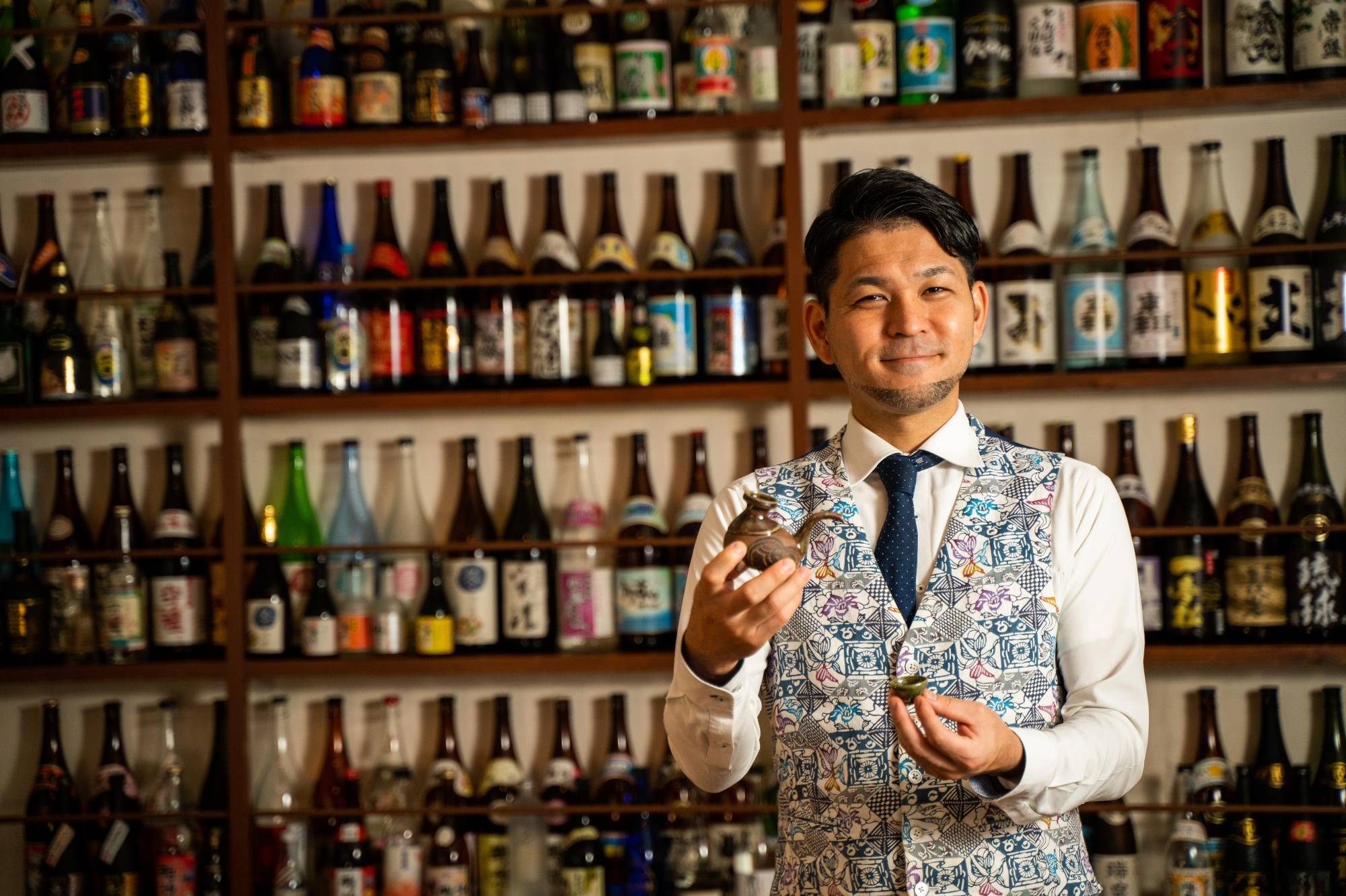 Koji Higa, manager of Naha-based awamori specialty bar Awamori Souko, believes Okinawa’s indigenous spirit deserves much more than its rough-and-tumble reputation suggests. | COURTESY OF AWAMORI SOUKO